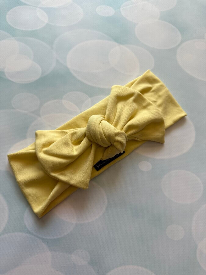 The knotting dusty yellow bow